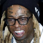 La signification du tatouage du visage TNT de Lil Wayne