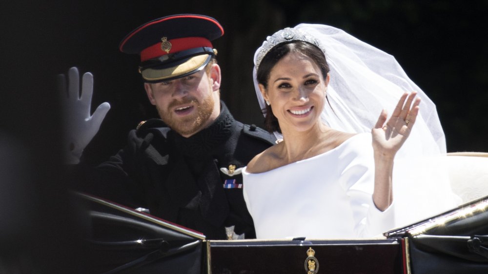 Le prince Harry et Meghan Markle en calèche le jour de leur mariage en 2018