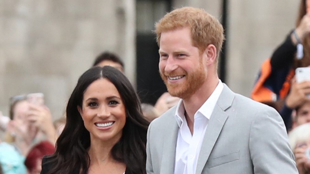 Ce que le prince Harry emoji textes à Meghan Markle dit sur leur amour, selon un expert en relations