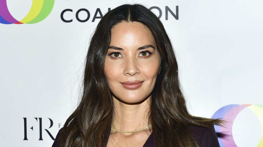 Olivia Munn smiling at promotional event