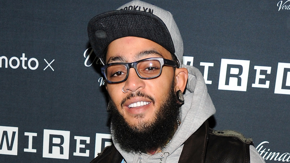 Travie McCoy souriant