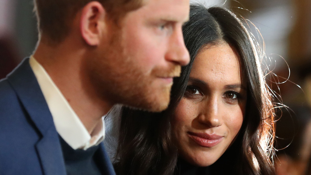 Prince Harry et Meghan Markle aux expressions neutres