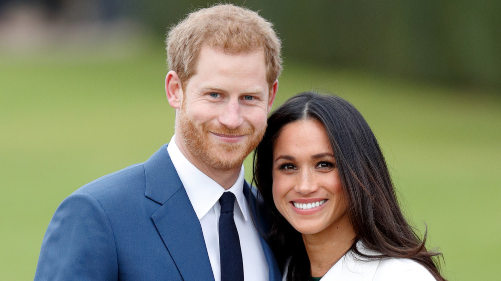 Prince Harry et Meghan Markle souriant