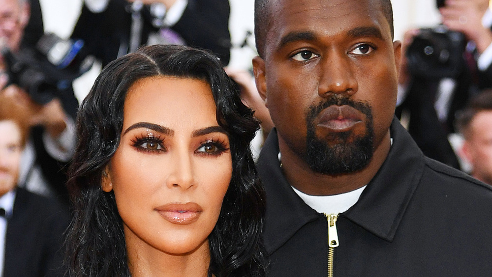 Kanye West, Kim Kardashian souriant