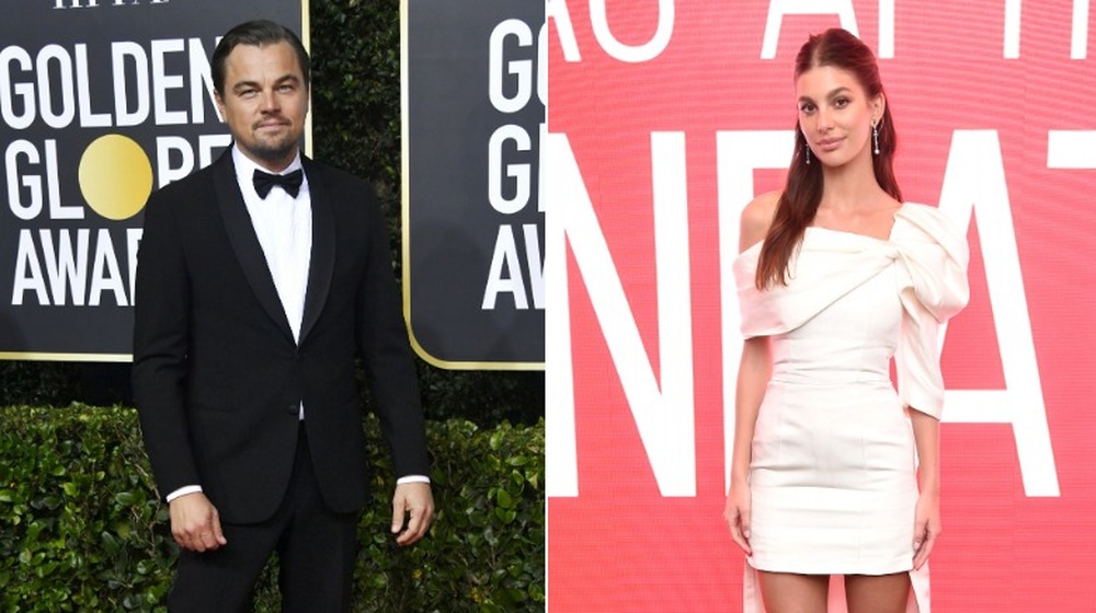 Leonardo DiCaprio et Camila Morrone posant sur un tapis rouge