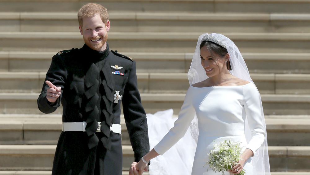 Le prince Harry et Meghan Markle sourient le jour du mariage