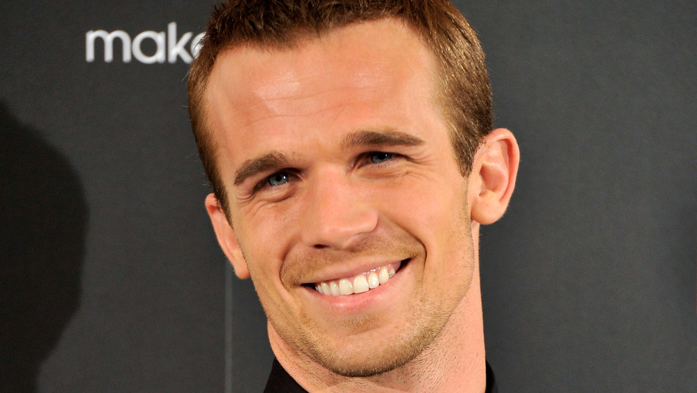 Cam Gigandet souriant lors d'un événement burlesque