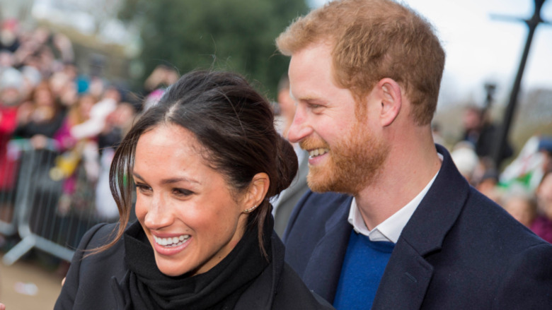 Meghan Markle et le prince Harry souriant 