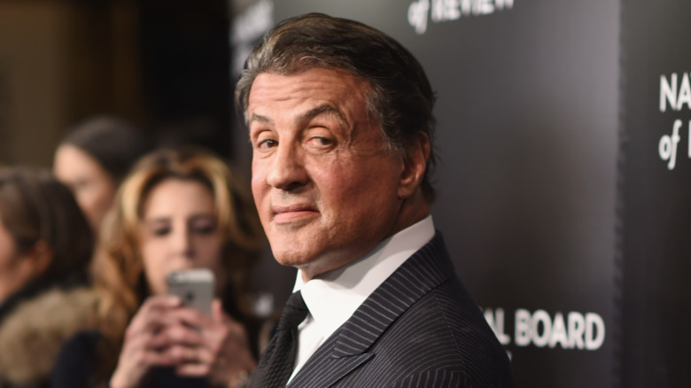 Sylvester Stallone looking over shoulder