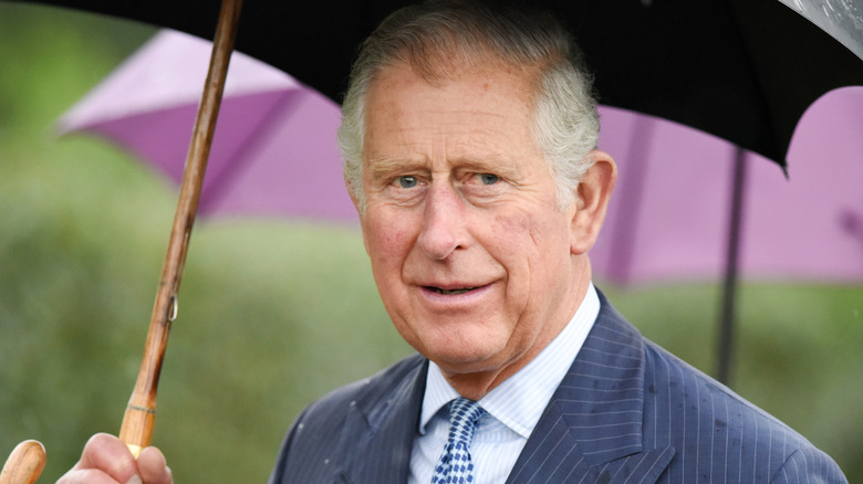 Prince Philip avec parapluie 