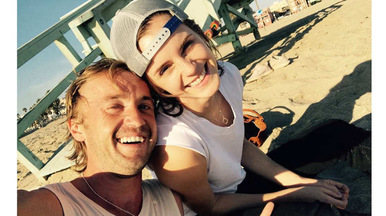 Tom Felton et Emma Watson à la plage