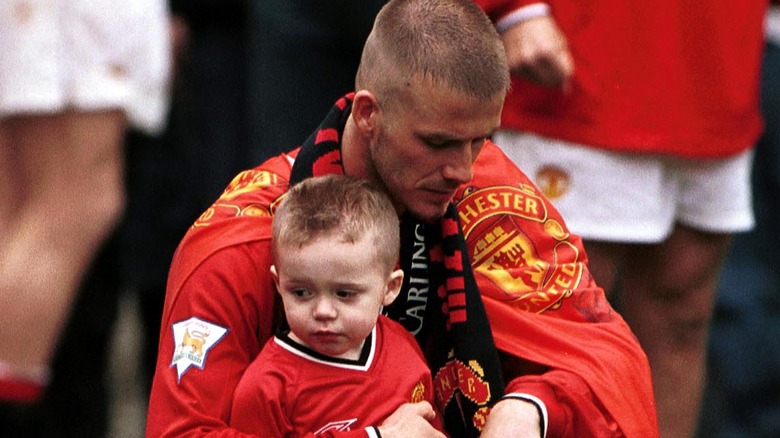 David Beckham holding baby Brooklyn 