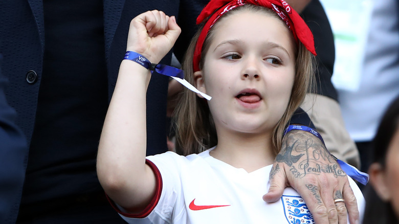 Harper Beckham celebrates at a soccer match 