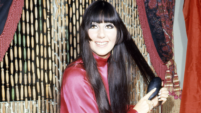 Cher brushing her hair