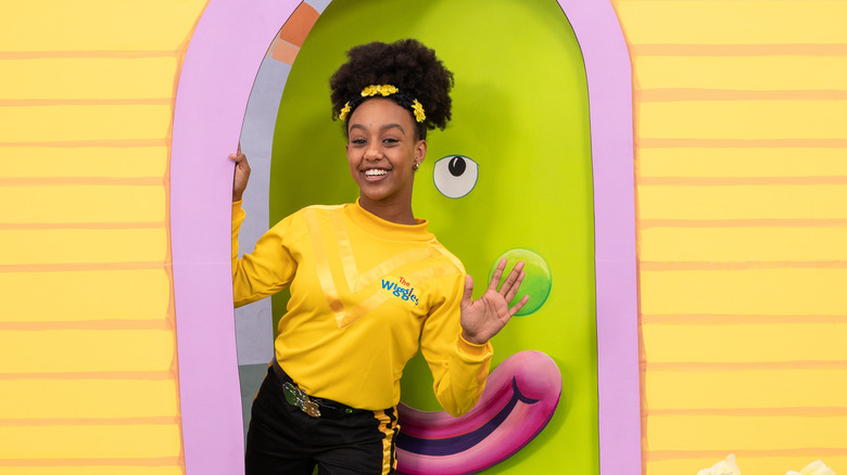 Tsehay Hawkins waving on The Wiggles set