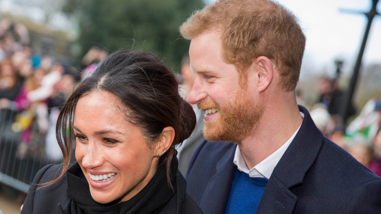 Meghan Markle et le prince Harry sourient