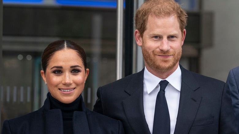 Prince Harry, Meghan Markle souriant