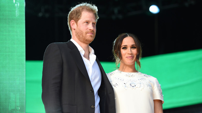 Le prince Harry et Meghan Markle sourient