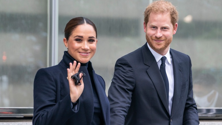 Le prince Harry et Meghan Markle sourient