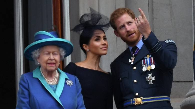 La reine Elizabeth avec le prince Harry et Meghan Markle