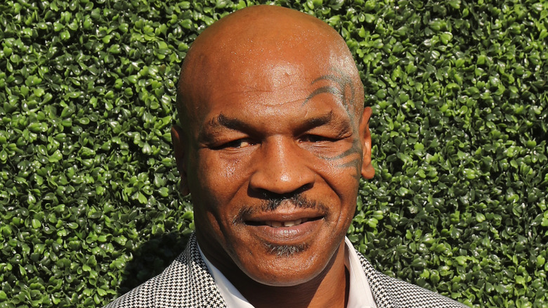 Mike Tyson lors d'un événement, souriant