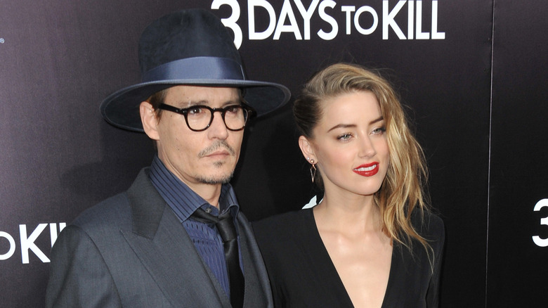 Johnny Depp et Amber Heard posent