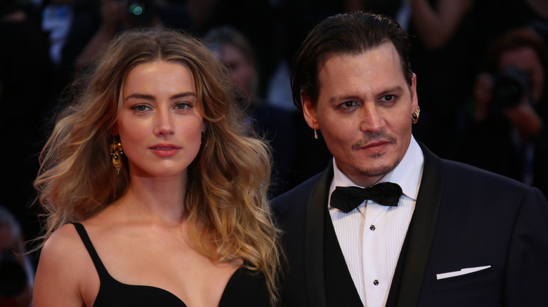 Amber Heard et Johnny Depp en tenue de soirée noire