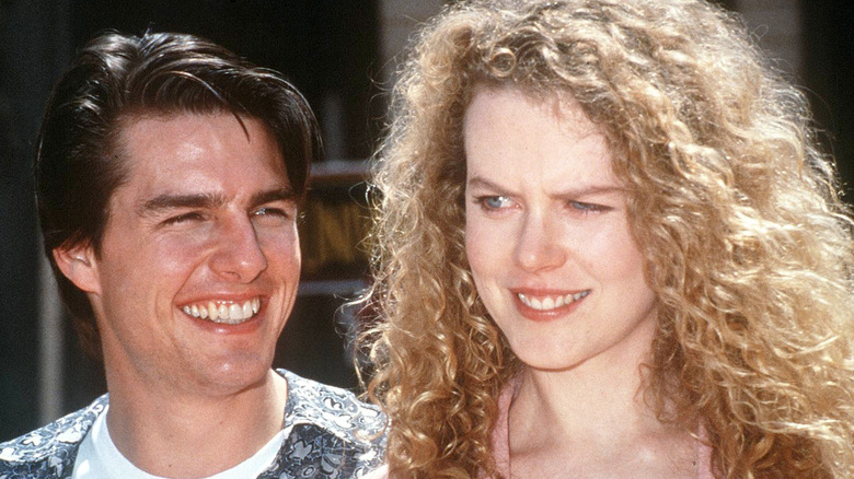 Tom Cruise rit Nicole Kidman l'air confus