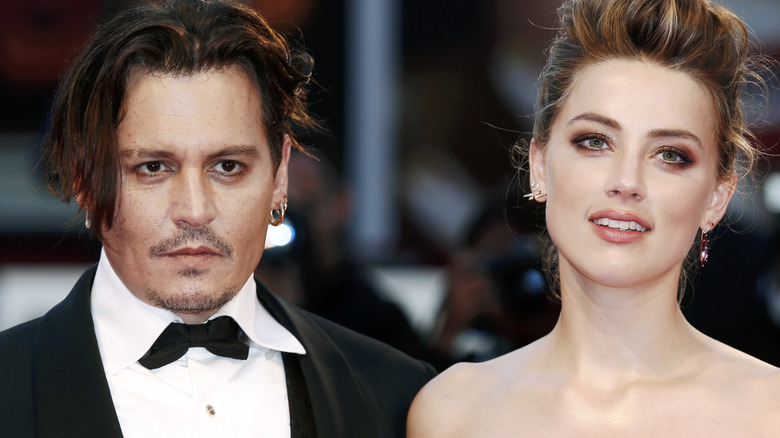 Ohnny Depp et Amber Heard posent