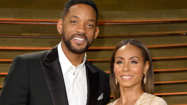 Will Smith et Jada Pinkett Smith posent et sourient