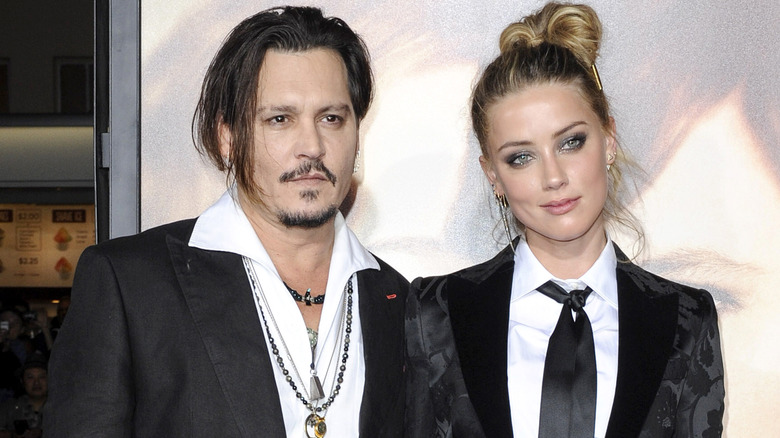 Johnny Depp et Amber Heard posent