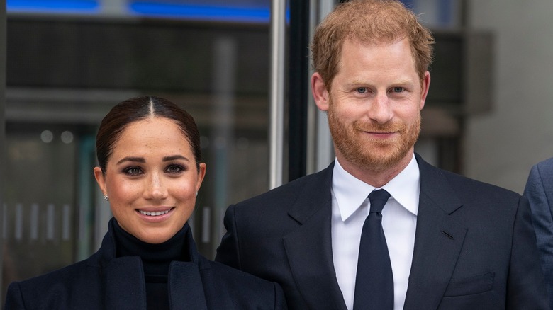 Meghan et Harry souriant