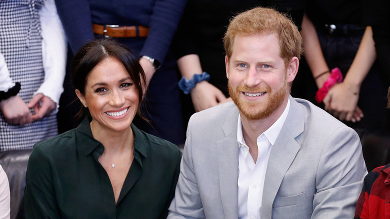 Le prince Harry et Meghan Markle sourient