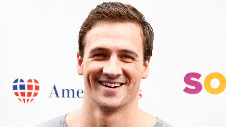 Ryan Lochte lors d'un événement, souriant