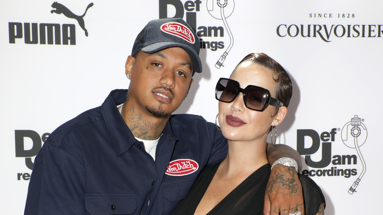 Alexander Edwards portant un chapeau avec Amber Rose