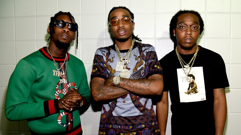 Migos portant des bijoux, posant ensemble