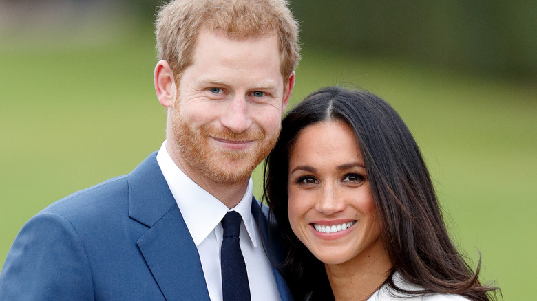 Le prince Harry et Meghan Markle sourient