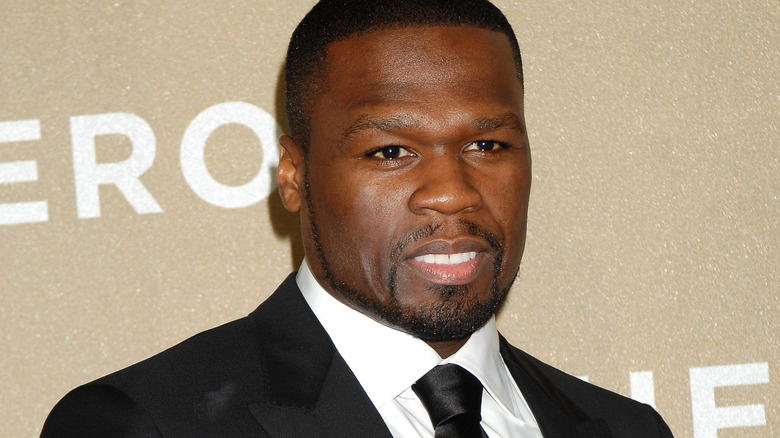 50 Cent tapis rouge souriant