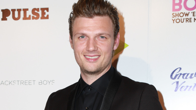 Nick Carter souriant à l'événement