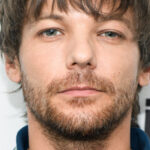 Louis Tomlinson avoue qu’il n’a pas toujours été content du succès solo de Harry Styles