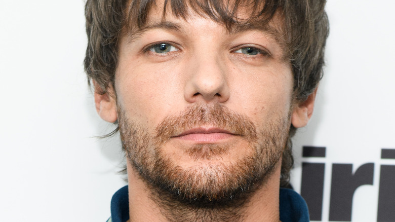 Louis Tomlinson avoue qu’il n’a pas toujours été content du succès solo de Harry Styles