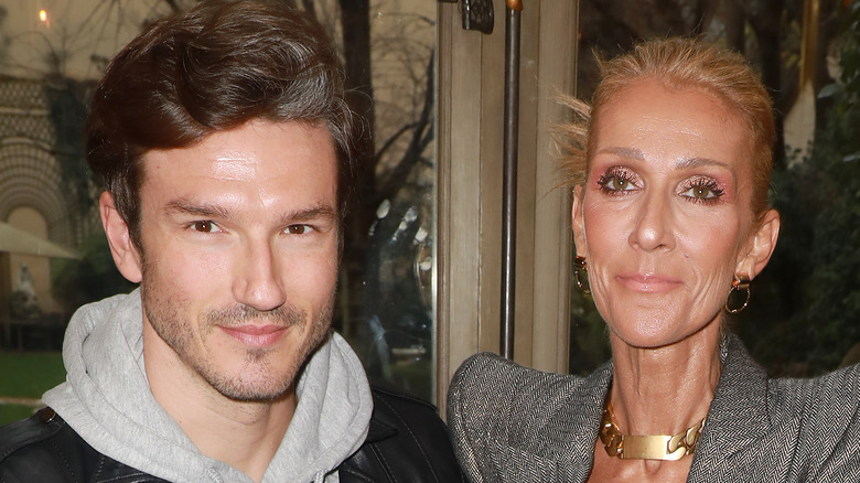 Céline Dion et Pepe Munoz souriants au défilé