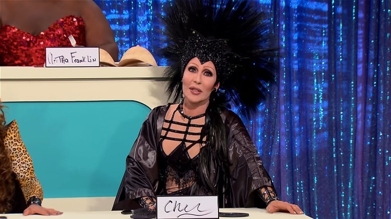 Chad Michaels dans le rôle de Cher dans le jeu Snatch de la saison 4 