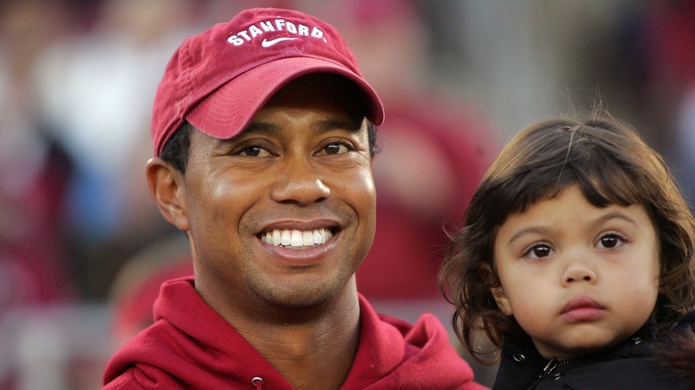 Sam Alexis Woods et Tiger Woods souriant