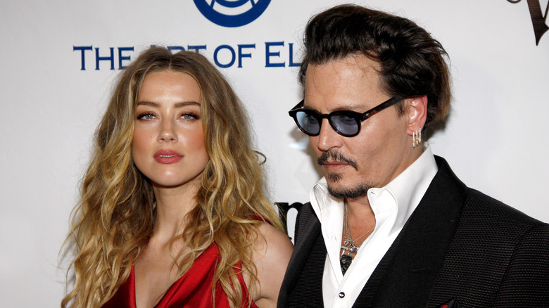 Johnny Depp et Amber Heard posent