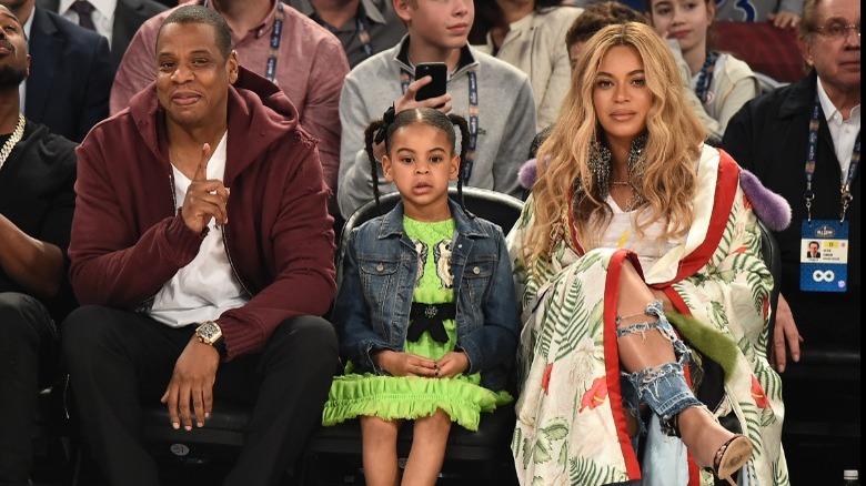 Jay-Z, Blue Ivy et Beyoncé à un événement sportif