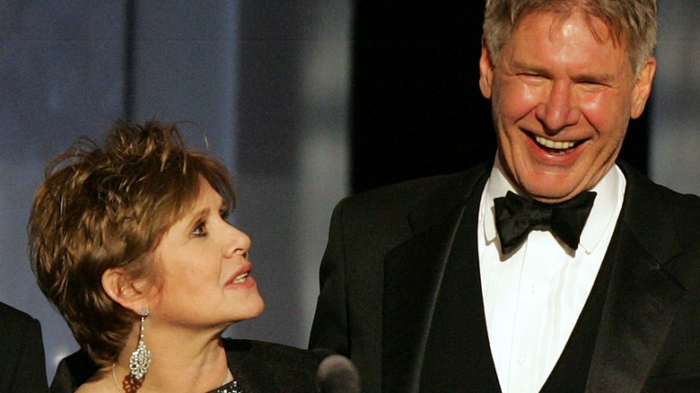 Harrison Ford et Carrie Fisher rient