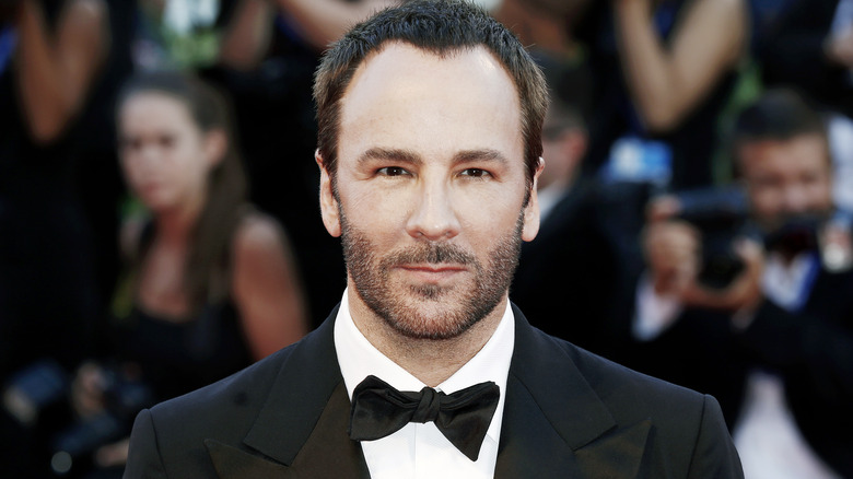 Tom Ford posant à l'événement