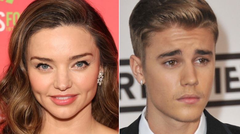 Miranda Kerr souriante, Justin Bieber plissant les yeux