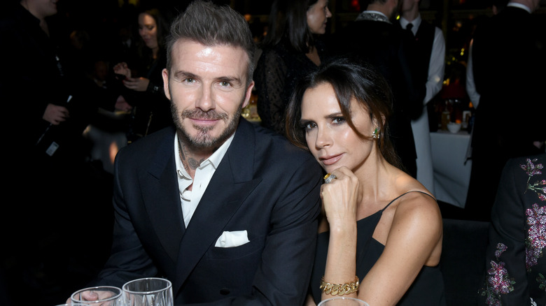 David et Victoria Beckham posent